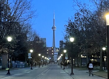 Image of the CN Tower and Post-lights from the Outdoor View in the Middle of the Street at the University of Toronto. Photo Credits: Kylie Ng