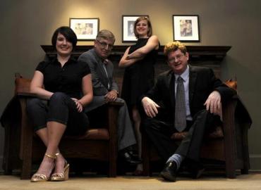 The summit junkies, U of T’s G20 Research Group, left to right: Erin Fitzgerald, student chair; Alan Alexandroff, co-director; Jenilee Guebert, director of research; and John Kirton, co-director.